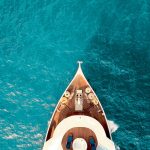 birds eye photography of boat on body of water